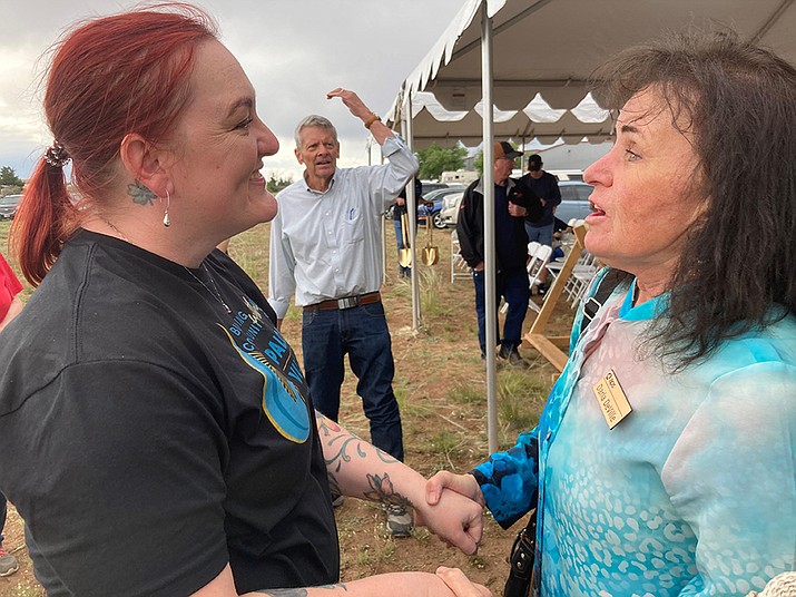 Coalition for Compassion and Justice Executive Director Allison Lenocker greets APS Northwest Division Public Affairs Manager Darla DeVille at the groundbreaking for the CCJ Paloma Village affordable housing project in Chino Valley Thursday, May 18, 2023. (Nanci Hutson/Courier)