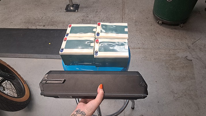 Seen above are lead acid batteries, and below it a lithium-ion battery. (Debra Winters/Courier)