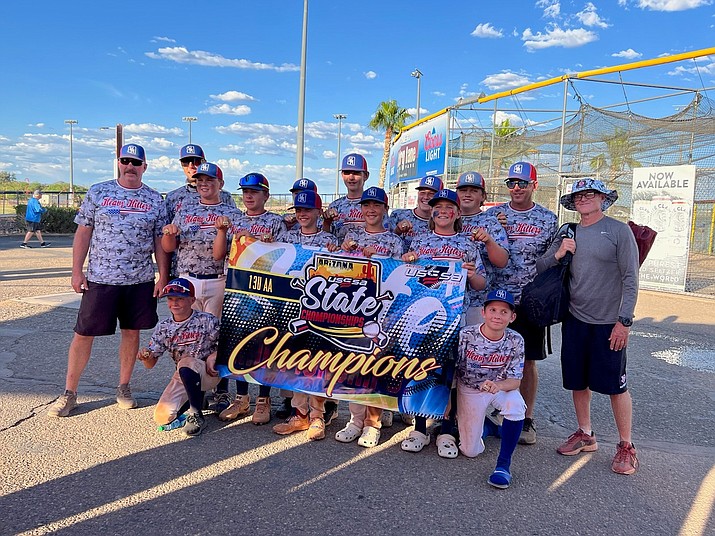 The 13U AA AZ Heavy Hitters, a travel baseball team based in Prescott, have won their last three tournaments, helping them earn the No. 1 spot in the state and No. 6 in the nation in the USSSA power rankings. This photo shows the team posing with their championship banner after clinching first place in the USSSA State Championships on Sunday, May 21, 2023. (Brad Duryea/Courtesy)