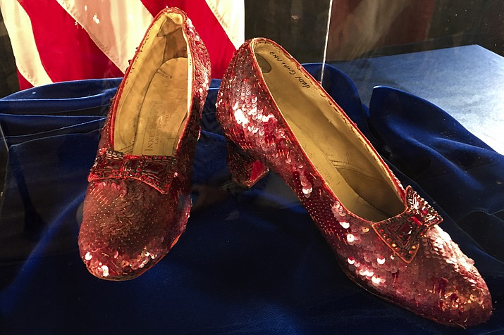 A pair of ruby slippers once worn by actress Judy Garland in the “The Wizard of Oz” sit on display at a news conference on Sept. 4, 2018, at the FBI office in Brooklyn Center, Minn. (Jeff Baenen/AP, File)