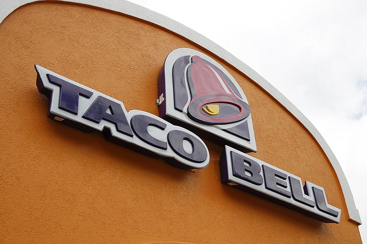 A sign hangs at a Taco Bell on May 23, 2014, in Mount Lebanon, Pa. Declaring a mission to liberate "Taco Tuesday" for all, Taco Bell asked U.S. regulators Tuesday, May 16, 2023, to force Wyoming-based Taco John's to abandon its longstanding claim to the trademark. (AP Photo/Gene J. Puskar, File)