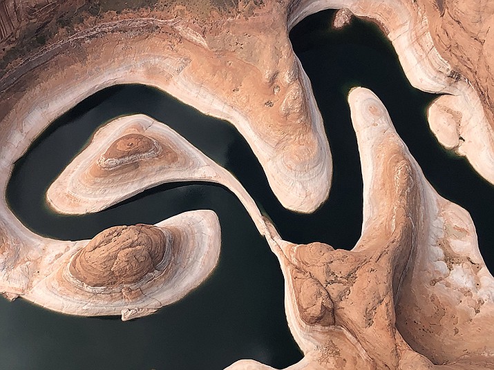 Reflection Canyon, upstream of Lake Powell, in June 2021 shows the “bathtub ring” of rock exposed as lake levels fall to historic lows. A plan by lower Colorado River basin states would save 3 million acre-feet of water by 2026, but experts say a longer-term plan is needed to address the rising demand and ongoing drought continue to drain the river. (Photo courtesy National Park Service)