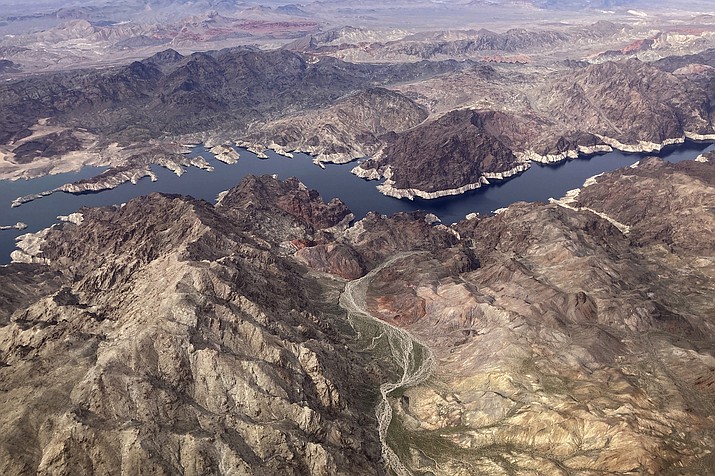 A bathtub ring shows where the water mark on Lake Mead once was along the boarder of Nevada and Arizona, March 6, 2023, near Boulder City, Nev. Nearly half of the U.S. West has emerged from drought, but intense water challenges persist, scientists said Tuesday, May 9. (AP Photo/John Locher, File)