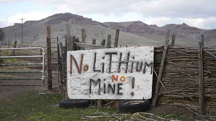 A "No Lithium No Mine" sign is displayed on April 24, 2023, on the Fort McDermitt Indian Reservation, near McDermitt, Nev. The Biden administration says it has completed a court-ordered review that should ensure construction continues at the Nevada lithium mine, despite legal challenges brought by conservationists and tribal leaders. (AP Photo/ Rick Bowmer)