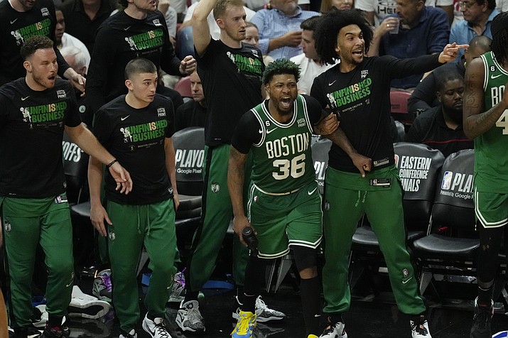 Boston Celtics players cheer during the second half of Game 4 during the Eastern Conference finals against the Miami Heat, Tuesday, May 23, 2023, in Miami. (Rebecca Blackwell/AP)