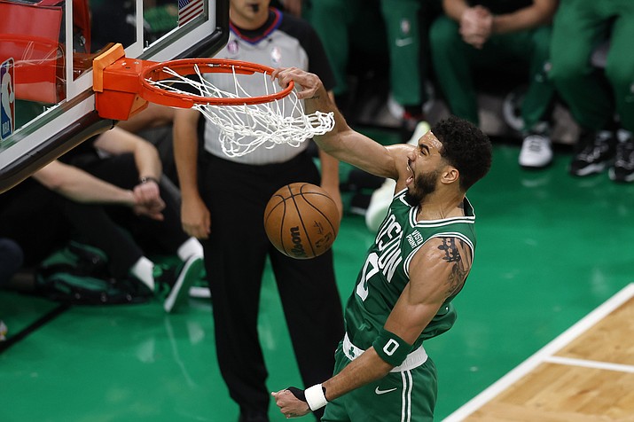 Boston Celtics forward Jayson Tatum dunks during the first half in Game 5 of the Eastern Conference finals against the Miami Heat Thursday, May 25, 2023, in Boston. (AP Photo/Michael Dwyer)