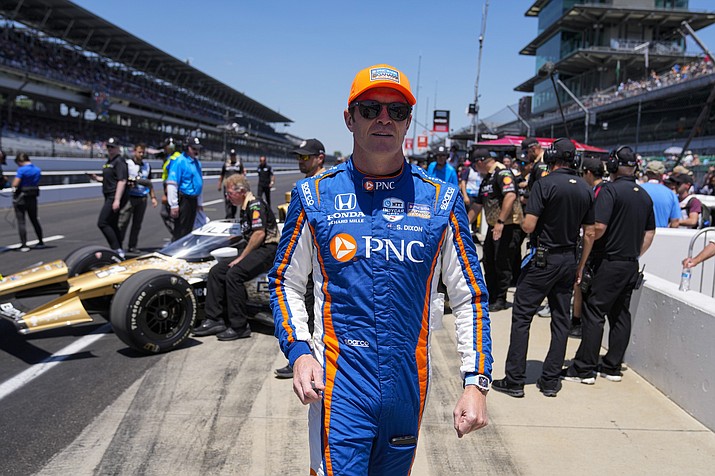 Scott Dixon, of New Zealand, walks to his car before the start of qualifications for the Indianapolis 500 auto race at Indianapolis Motor Speedway in Indianapolis, Sunday, May 21, 2023. (Michael Conroy/AP)