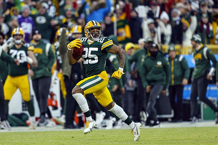 Green Bay Packers cornerback Keisean Nixon (25) runs back a kickoff for a touchdown during a game against the Minnesota Vikings Sunday, Jan. 1, 2023, in Green Bay, Wis. The NFL has pushed the kickoff return further toward irrelevance with a priority on player safety. League owners voted Tuesday, May 23, 2023, for a one-year trial of an enhanced touchback rule that will give the receiving team the ball at its own 25 with a fair catch of a kickoff anywhere behind that yard line. (Jeffrey Phelps/AP)