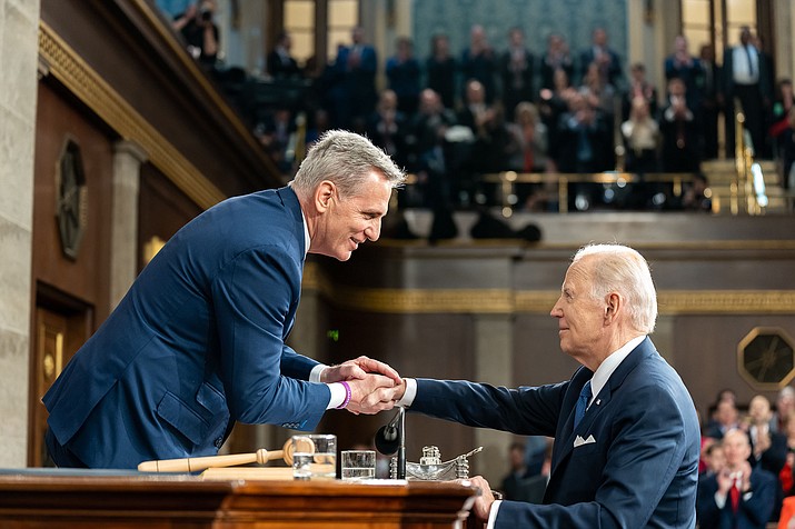 President Joe Biden greets House Speaker Kevin McCarthy before the State of the Union address in February. The two men have been unable to agree on a plan to raise the debt ceiling, pushing the country closer to a June 1 default on the government’s obligations. (Adam Schultz/The White House via Cronkite News)