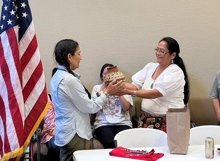Havasupai Tribal Coalition Coordinator Carletta Tilousi gifts a basket to Interior Secretary Deb Haaland May 25. (Photo/Havasupai Tribe)