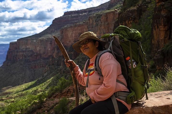 Havasupai tribal leader Carletta Tilousi takes a break while hiking into the Grand Canyon on Friday, May 5, 2023. The tribe held a blessing ceremony to mark the renaming of the campground from Indian Garden to Havasupai Gardens. (AP Photo/Ty O'Neil)