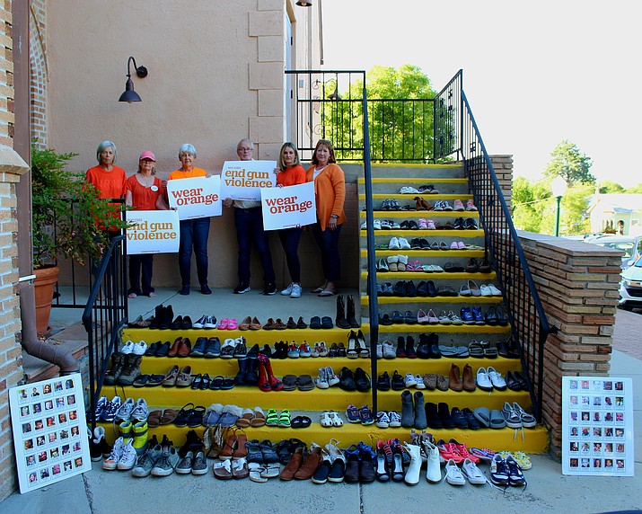 This photo reflects more than 120 pairs of empty shoes, representing the number of young lives lost to gun violence every day in our country. (Moms Demand Action, Prescott Chapter/Courtesy)