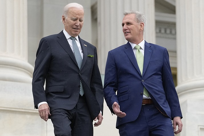 President Joe Biden talks with House Speaker Kevin McCarthy of Calif., as they walk down the House steps as they leave after attending an annual St. Patrick's Day luncheon gathering at the Capitol in Washington, March 17, 2023. The Tuesday, May 9, White House sitdown between the president and congressional leaders will be the first substantive talks between Biden and McCarthy in months, and comes weeks after House Republicans voted on a bill that would raise the debt limit but impose significant federal spending cuts. (Alex Brandon/AP, File)