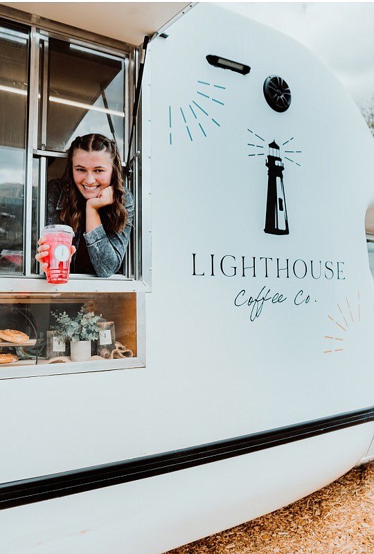 Kiley Steidinger in the window of her Lighthouse Coffee LLC mobile coffee and energy drink truck, a renovated former pizza delivery truck. Kiley and her parents acquired their food truck license in January, and her first paying gig was in March. (Kiley Steidinger/Courtesy)