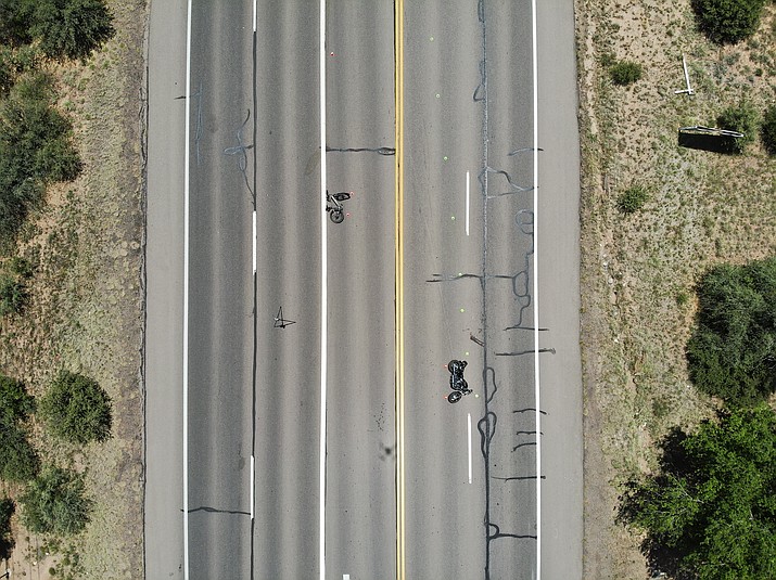 An electric bicycle and a motorcycle laid out on Willow Creek Road in Prescott after the operators of the two vehicles collided on Saturday, June 3, 2023. Both patients were sent to the hospital with serious injuries. (Prescott Police/Courtesy)