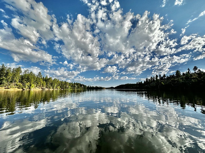 Scattered clouds hover over Lynx Lake and reflect off the water on a gorgeous day in Prescott.(Karen Shaw/Courtesy)