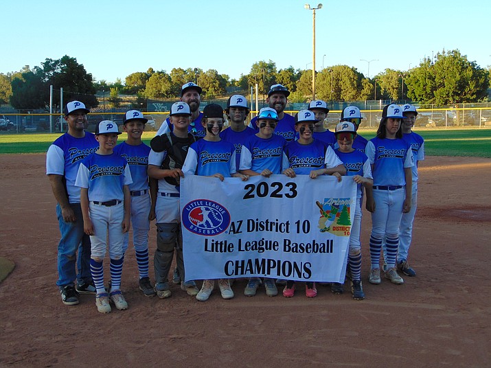 The Prescott Majors Little League All-Star team holds up the championship banner after defeating Prescott Valley to win the District 10 tournament on Saturday, June 24, 2023, at Bill Vallely Field in Prescott. (Jon Holdsworth/For the Courier)
