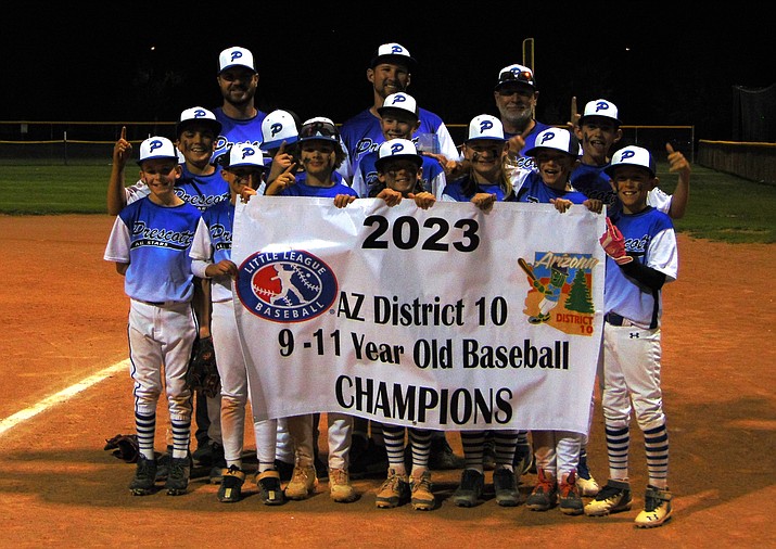 The Prescott 11U Little League All-Star team holds up the championship banner after defeating Prescott Valley to win the District 10 tournament on Thursday, June 22, 2023, at Mountain Valley Park in Prescott Valley. (Jon Holdsworth/For the Courier)