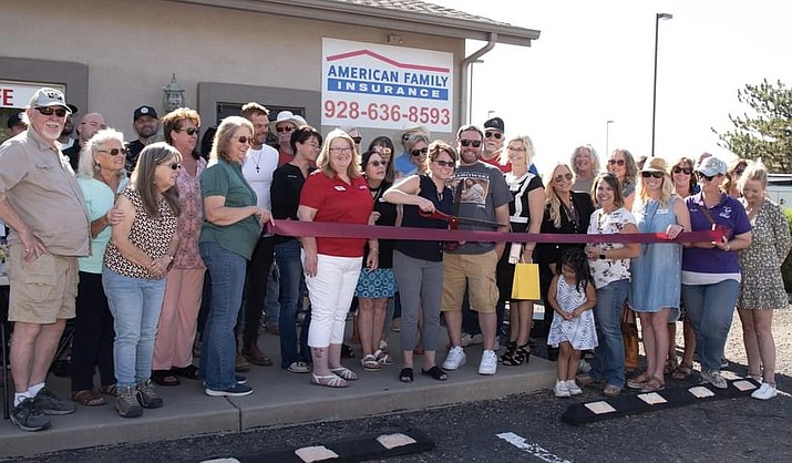 Nearly 100 people recently attended the Grand Re-Location, BBQ Party and Ribbon Cutting for American Family Insurance, Leah McLemore, at 1578 Highway 89, Chino Valley. Leah is handling the scissors, and to her left is Production Specialist MeLynda Davis. Holding the ribbon ends are members of the Chino Valley Lioness Club. The event, sponsored by ServiceMaster, The Happy Hippie and Fresh Home, was attended by Chino Vallley Mayor Jack Miller, and Town Council members Annia Perkins and Bob Schecherer. For information on Leah’s AmFam Insurance agency, call 928-636-8593. (Courtesy)
