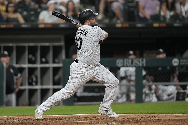 Chicago White Sox's Jake Burger watches his home run against the Cleveland Guardians during the fifth inning of a game Thursday, July 27, 2023, in Chicago. (Erin Hooley/AP)