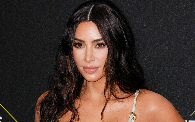 Kim Kardashian Flaunts Toned Figure In Metallic Gold Bikini During 