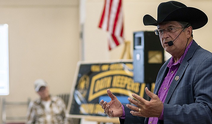 In this photo provided by the Arizona Center for Investigative Reporting, Constitutional Sheriffs and Peace Officers Association founder Richard Mack speaks to a crowd of about 100 people at a Yavapai County Preparedness Team meeting in Chino Valley, Ariz., Oct. 8, 2022. Mack regularly speaks at events and trainings for the public, law enforcement and county officials. (Isaac Stone Simonelli/Arizona Center for Investigative Reporting)