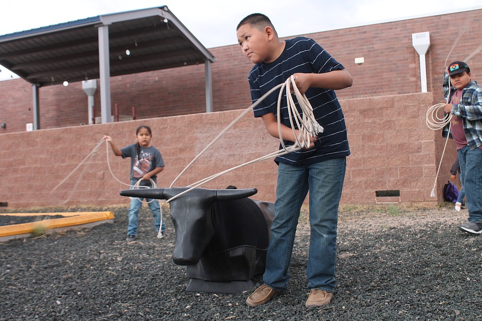 Brayden Chee practices dummy rope  with Ian Smallcanyon, left, and Colten Begaye at the playground before classes begin.