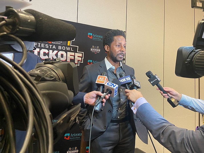 Former Heisman Trophy winner and ESPN College Gameday analyst Desmond Howard, the keynote speaker at the 2023 Arizona Bank & Trust Fiesta Bowl Kickoff Luncheon, spoke to the media about conference realignment, NIL and his football playing career. (Jonah Krell/Cronkite News)