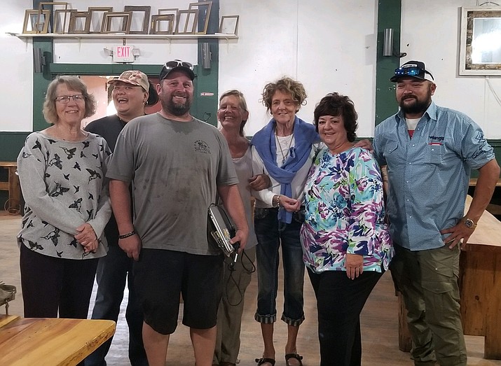 Sultana Bar manager Jason Olson joined 
volunteers after a successful community swap Aug. 13 (Submitted photo)