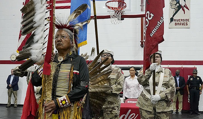 James Nells, of the Navajo Nation, a teacher at Riverside Indian School, leads the Riverside Indian School color guard during opening ceremonies Saturday, July 9, 2022, in Anadarko, Oklahoma, for a meeting to allow U.S. Secretary of the Interior Deb Haaland, rear, to hear about the painful experiences of Native Americans who were sent to government-backed boarding schools designed to strip them of their cultural identities. The list of boarding schools in the U.S. that once sought to “civilize” Native Americans, Alaska Natives and Native Hawaiians is getting longer. The National Native American Boarding School Healing Coalition released a new interactive map Wednesday, Aug. 30, 2023. (AP Photo/Sue Ogrocki, File)