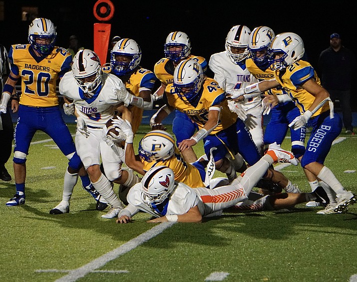The Prescott defense attempts to tackle Thunderbird OLB Tyler Woods (8) during a game on Friday, Sept. 1, 2023, at Bill Shepard Field in Prescott. (Aaron Valdez/Courier)