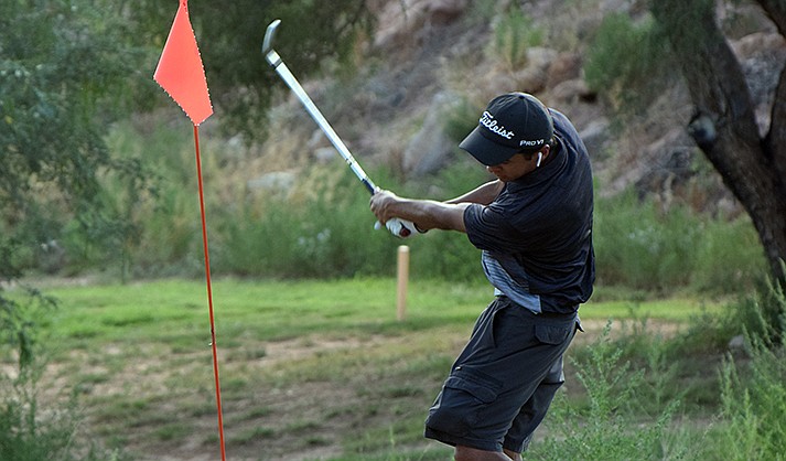 Mingus junior golfer Javan Sutter follows through off the tee. (VVN/Paige Daniels)