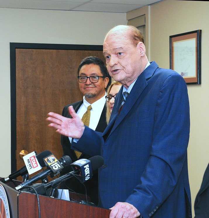State schools chief Tom Horne, flanked by staffers, explains Tuesday the plan to reallocate $40 million of federal dollars that had been going to other programs to instead offer tutoring to students who are not 
proficient in reading or math. (Howard Fischer/Courtesy)