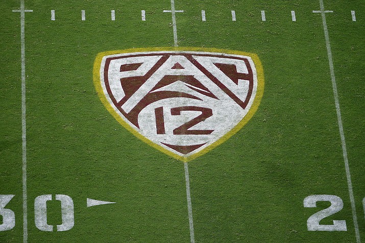 The field at Sun Devil Stadium bears a Pac-12 logo during an NCAA college football game between Arizona State and Kent State in Tempe, Arizona, Aug. 29, 2019. The Atlantic Coast Conference has cleared the way for Stanford, California and SMU to join the league, two people with direct knowledge of the decision told The Associated Press on Friday, Sept. 1, 2023, providing a landing spot for two more teams from the disintegrating Pac-12. (Ralph Freso/AP, File)