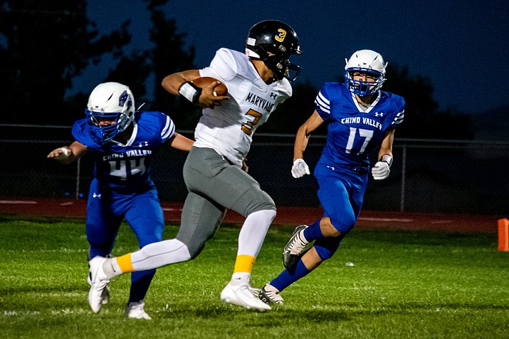 Chino Valley fullback Skyler Vorpahl (44) and defensive end Dayton Soza attempt to tackle the runner during a game against Maryvale on Friday, Sept. 8, 2023, at Cougar Stadium in Chino Valley. (Chris Ortiz/For the Courier)