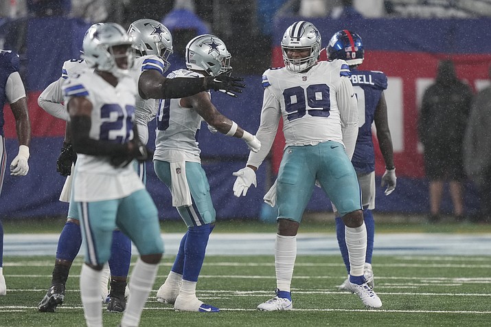 Dallas Cowboys’ Chauncey Golston, right, celebrates during the second half of a game against the New York Giants, Sunday, Sept. 10, 2023, in East Rutherford, N.J. (Bryan Woolston/AP)