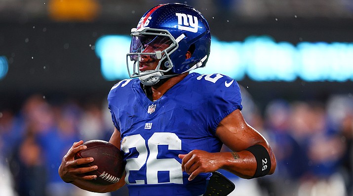 Saquon Barkley breaks a decades-long offensive drought for the Giants on  Thanksgiving Day 