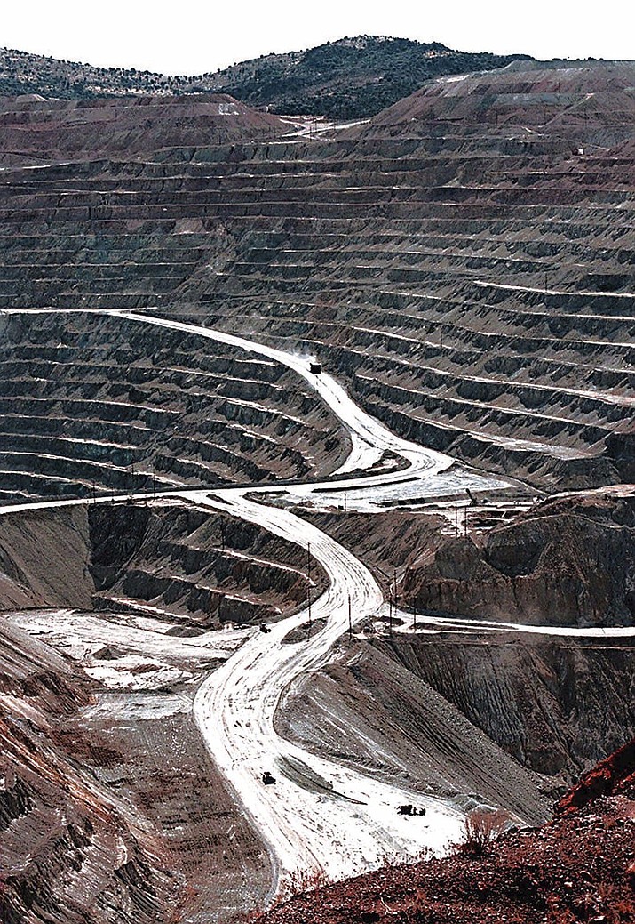 Terraces cut into the hillside at the huge Santa Rita copper mine in Grant County, N.M., are shown in this March 1999 file photo. The Biden administration is recommending changes to a 151-year-old law that governs mining for copper, gold and other hardrock minerals on U.S.-owned lands, including making companies pay royalties on what they extract. (Richard Pipes/The Albuquerque Journal via AP, File)