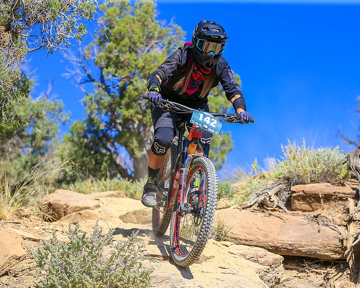 Tiona Eversole, Diné, rides down the Sunrise Trail at the Rezduro enduro mountain bike race Aug. 19 in Hardrock, Ariz. Eversole won the Category 2, age 19-39 women’s division with a time of 13:44.5. (Photo/1newsmedia)