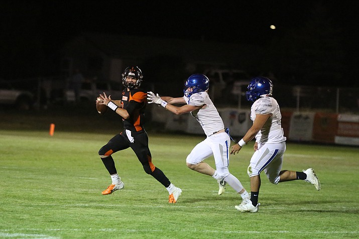 Williams quarterback Jack Dent evades the Bagdad defense in a game at home Sept. 8. (Marilyn R. Sheldon/WGCN)