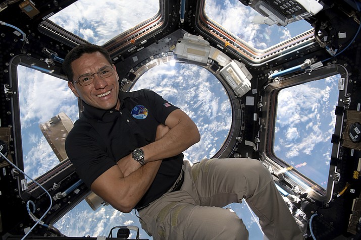 This image provided by NASA shows astronaut Frank Rubio floating inside the cupola, the International Space Station’s “window to the world.” Rubio now holds the record for the longest U.S. spaceflight. Rubio surpassed the U.S. record of 355 days on Monday, Sept. 11, 2023 at the International Space Station. He arrived at the outpost last September with two Russians for a routine six months. (NASA via AP)