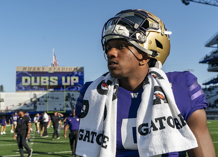 Washington quarterback Michael Penix Jr. walks on the field after a win over Tulsa in a game Saturday, Sept. 9, 2023, in Seattle. (Lindsey Wasson/AP)