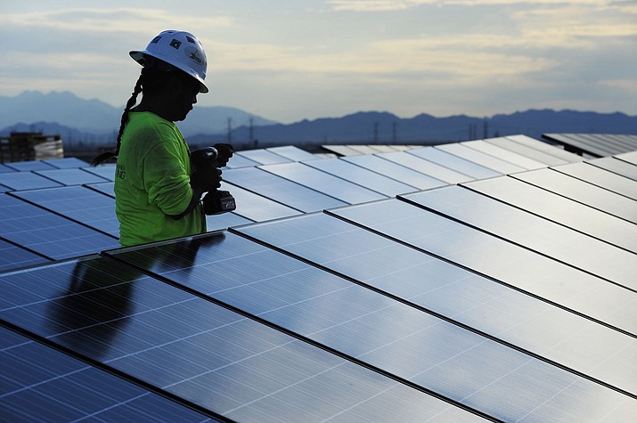 Jobs in clean-energy industries in Arizona – from solar power to electric vehicles to insulation – grew 4% between 2021 and 2022, when they employed 61,583 workers, a new report says. It continued the steady climb back from the steep loss of clean-energy jobs experienced nationwide during the COVID-19 pandemic. (Brandon Quester/Cronkite News, file)