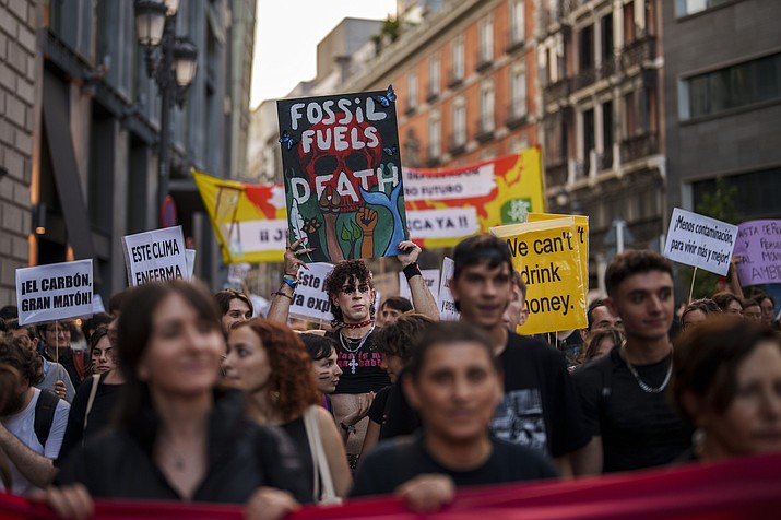 People take part in a Global Climate Strike "Fridays For Future" protest in Madrid, Spain, Friday, Sept. 15, 2023. Tens of thousands of climate activists around the world are set to march, chant and protest Friday to call for an end to the burning of planet-warming fossil fuels as the globe suffers dramatic weather extremes and record-breaking heat. (Manu Fernandez/AP)