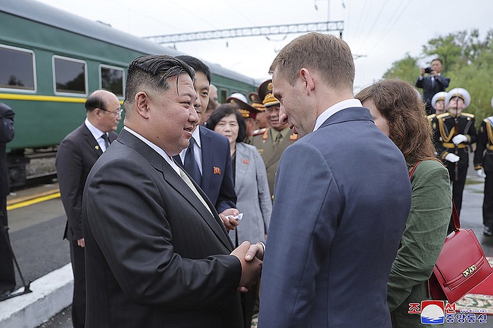 North Korea leader Kim Jong Un, front left, bids farewell to Russian Minister of Natural Resources and Ecology Alexander Kozlov, front right, at a station in Artyom, near Vladivostok, Russian Far East Sunday, Sept. 17, 2023. Independent journalists were not given access to cover the event depicted in this image distributed by the North Korean government. The content of this image is as provided and cannot be independently verified. Korean language watermark on image as provided by source reads: "KCNA" which is the abbreviation for Korean Central News Agency. (Korean Central News Agency/Korea News Service via AP)