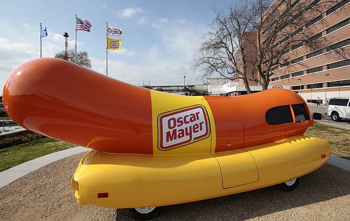 The Oscar Mayer Wienermobile sits outside the the Oscar Meyer headquarters, Oct. 27, 2014, in Madison, Wis. (M.P. King/Wisconsin State Journal via AP, File)