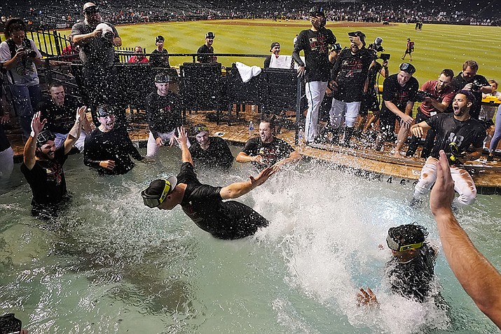 The Arizona Diamondbacks players celebrate in the Chase Field pool after clinching a Wild Card spot in the MLB playoffs after a baseball game against the Houston Astros, Saturday, Sept. 30, 2023, in Phoenix. The Astros won 1-0. (Ross D. Franklin/AP)