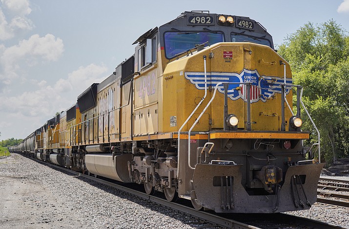 A Union Pacific train travels through Union, Neb., July 31, 2018. The federal government has joined a number of former workers in suing Union Pacific over the way it used its own vision test to disqualify workers the railroad believed were color blind and might have trouble reading signals telling them to stop a train. The new lawsuit was announced Monday, Oct. 2, 2023, by the Equal Employment Opportunity Commission. (Nati Harnik/AP, File)