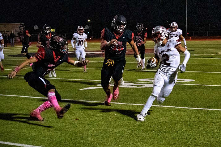 The Bradshaw Mountain defense attempts to tackle Mingus wide receiver Mario Camacho (2) during a game on Friday, Oct. 6, 2023, at Bob Pavlich Field in Prescott Valley. (Chris Ortiz/Courier)