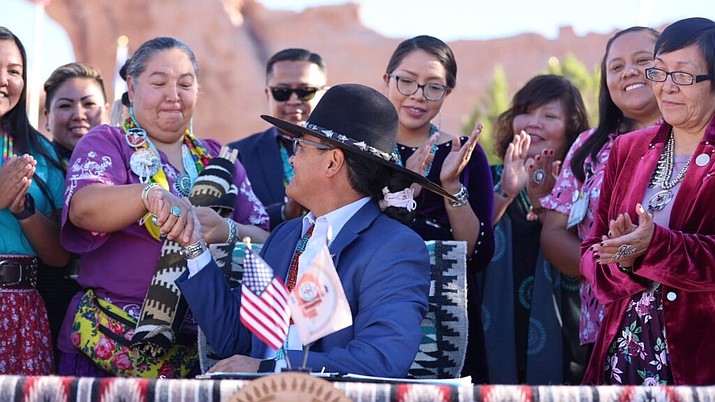 Navajo Nation President Buu Nygren shakes hands with Navajo Nation Council Delegate Amber Crotty’s during the signing of the Navajo Nation Victims Rights Act of 2023 Sept. 6. Crotty also spoke at the Flagstaff Indigenous Peoples Day event Oct. 9 (Photo/OPVP)